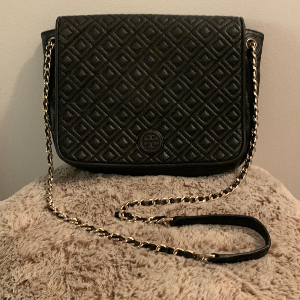 Tory Burch butter soft leather delicately loved. Black with magnetic closure.